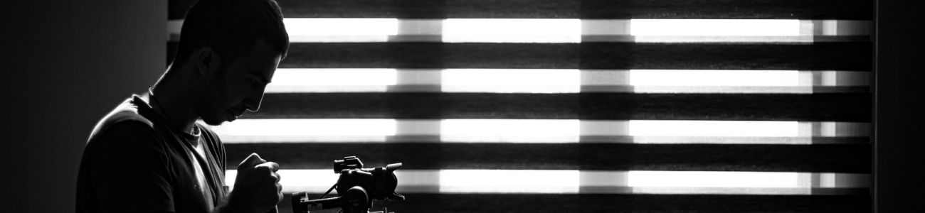 photographer-checking-his-camera-darkness